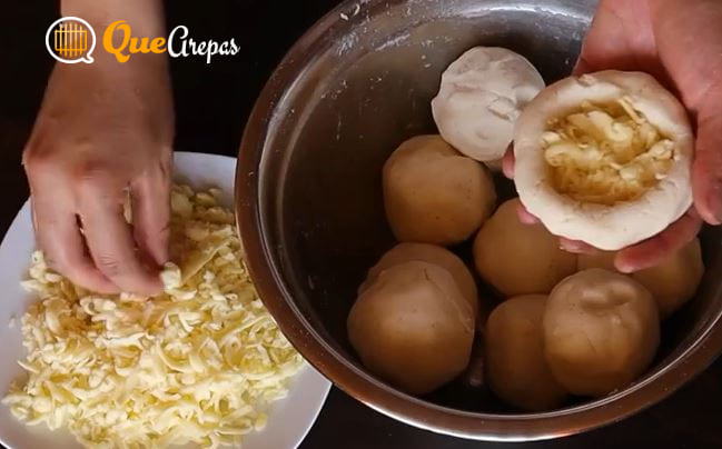 Adding the cheese to the Arepa with Cheese - quearepas.com