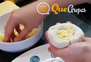 Putting cheese on Arepas with cheese - quearepas.com