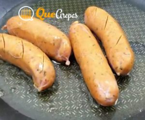 Frying chorizos - bandeja paisa - quearepas.com